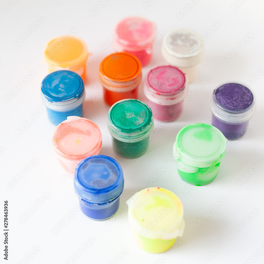 bright gouache paints on white background,multi-colored tubes of paints bright gouache paints on white background,multi-colored tubes of paints
