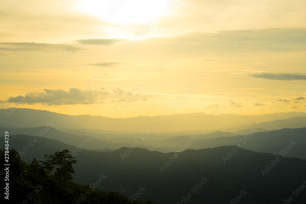 The longitudinal mountains and the setting sun and the forest on Doi Tung