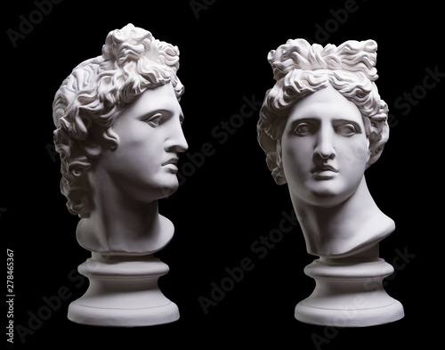 Statue. On a black isolated background. Gypsum statue of Apollo's head. Man.Statue. On a black isolated background. Gypsum statue of Apollo's head. Man. photo