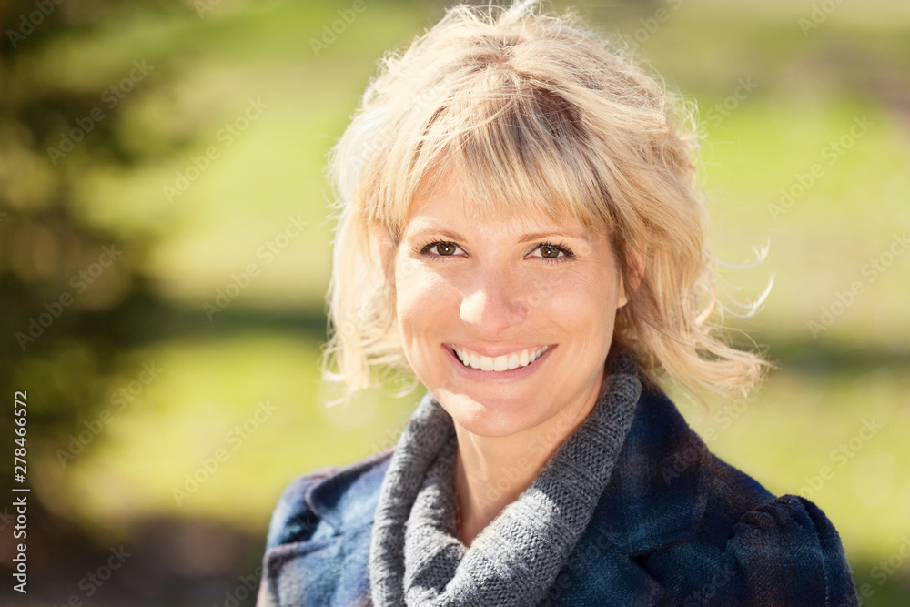 Portrait Of A Mature Woman Smiling At The Camera. She is a happy mother Portrait Of A Mature Woman Smiling At The Camera. She is a happy mother