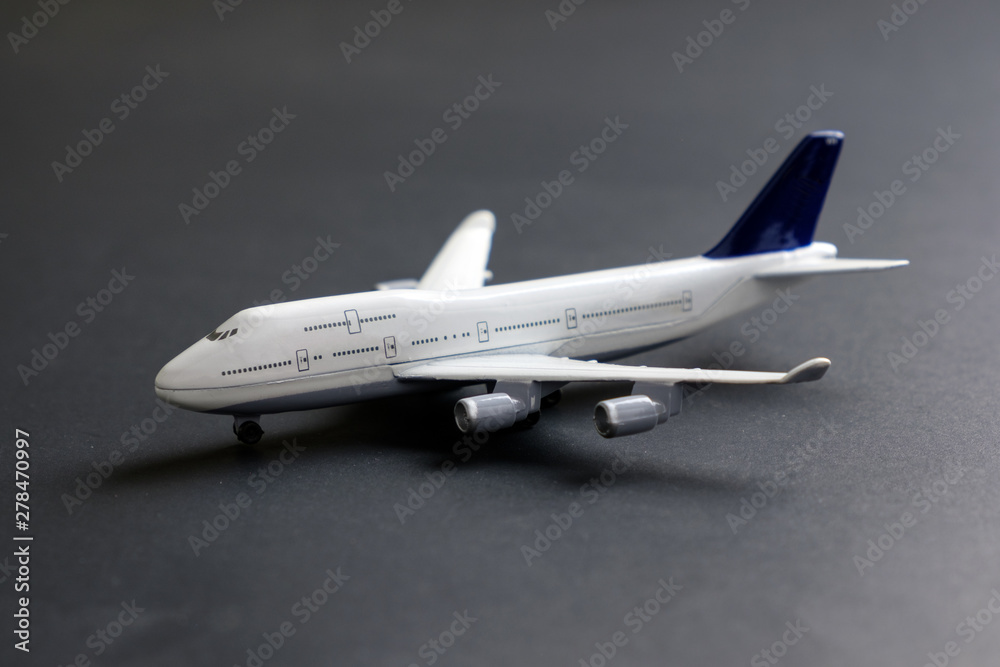 Model commercial airplane on dark color background Model commercial airplane on dark color background