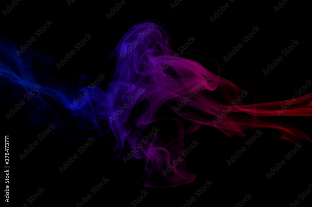Obraz premium abstract red against blue gradient color smoke in the air on black background