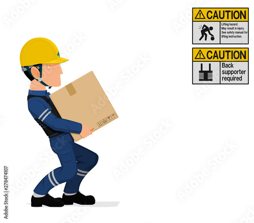 An industrial worker is carrying a heavy paper crate