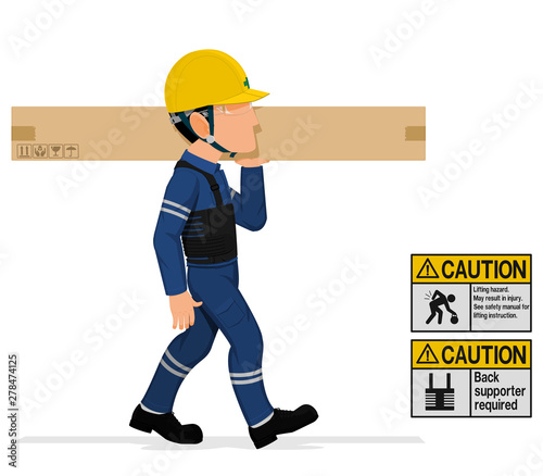 An industrial worker is carrying a long paper crate