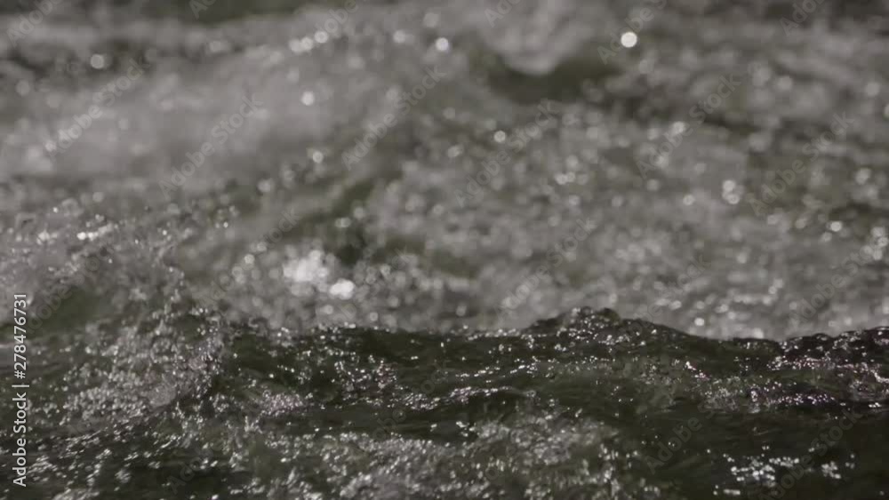 Slow motion up close shot of steam running quickly, pure water clean Slow motion up close shot of steam running quickly, pure water clean