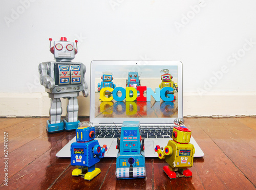 robot kids learn code from a laptop