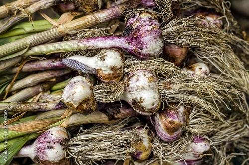 Close up of a stack of garlic.