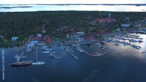 Drone shot at dusk over the Sandhamn marina as boats arrive for the annual round Gotland boat race. photo