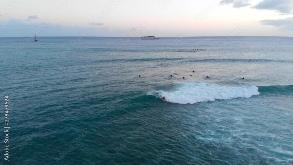 Aerial of Bodyboard Surfer doing 360 spin at Golden Hour in Honolulu, Hawaii. Aerial of Bodyboard Surfer doing 360 spin at Golden Hour in Honolulu, Hawaii.