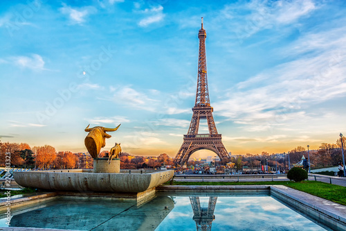 Eiffel Tower at sunset in Paris, France. Romantic travel background photo