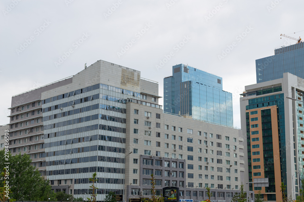 Astana, Kazakhstan - 11. 06. 2019: Walking through the city with a camera and photographs of various skyscrapers. The new capital of Kazakhstan is Astana. Astana, Kazakhstan - 11. 06. 2019: Walking through the city with a camera and photographs of various skyscrapers. The new capital of Kazakhstan is Astana.