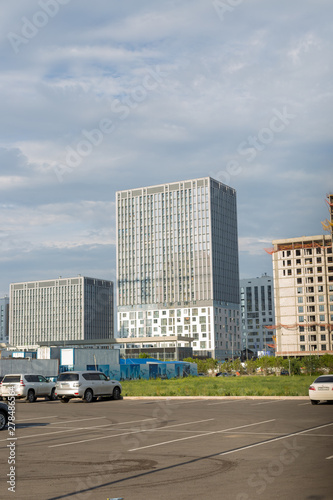 Astana, Kazakhstan - 11. 06. 2019: Walking through the city with a camera and photographs of various skyscrapers. The new capital of Kazakhstan is Astana. © donikz