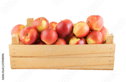 Red apples in wooden box isolated on white