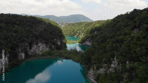 Shot Four. Beautiful Aerial Crane Shot of Plitvice Lakes with Clouds Peeling Away. photo