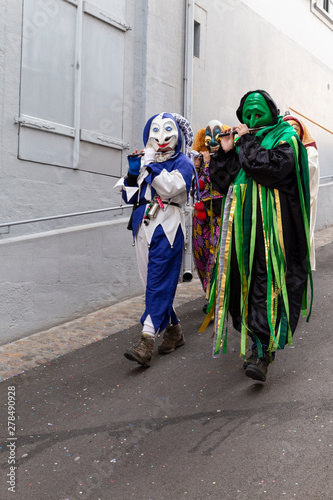 Archivgaesslein, Basel, Switzerland - March 12th, 2019. Close-up of a small disguised group of piccolo flute players