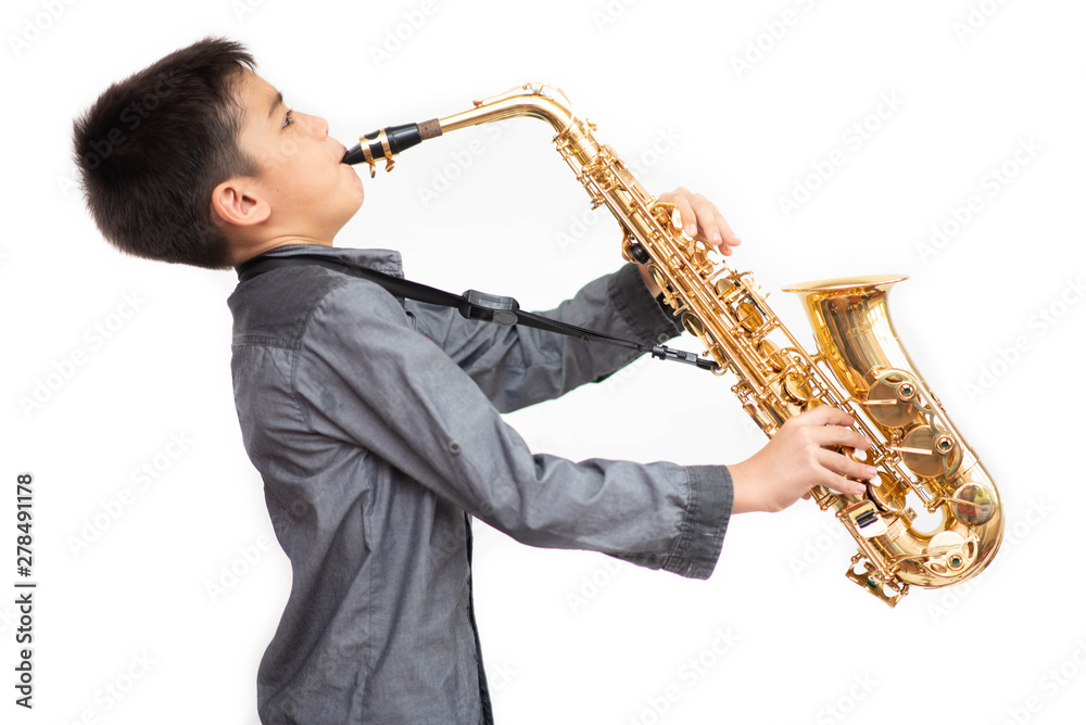 Fototapeta premium Little asian musician boy playing saxophone instrument