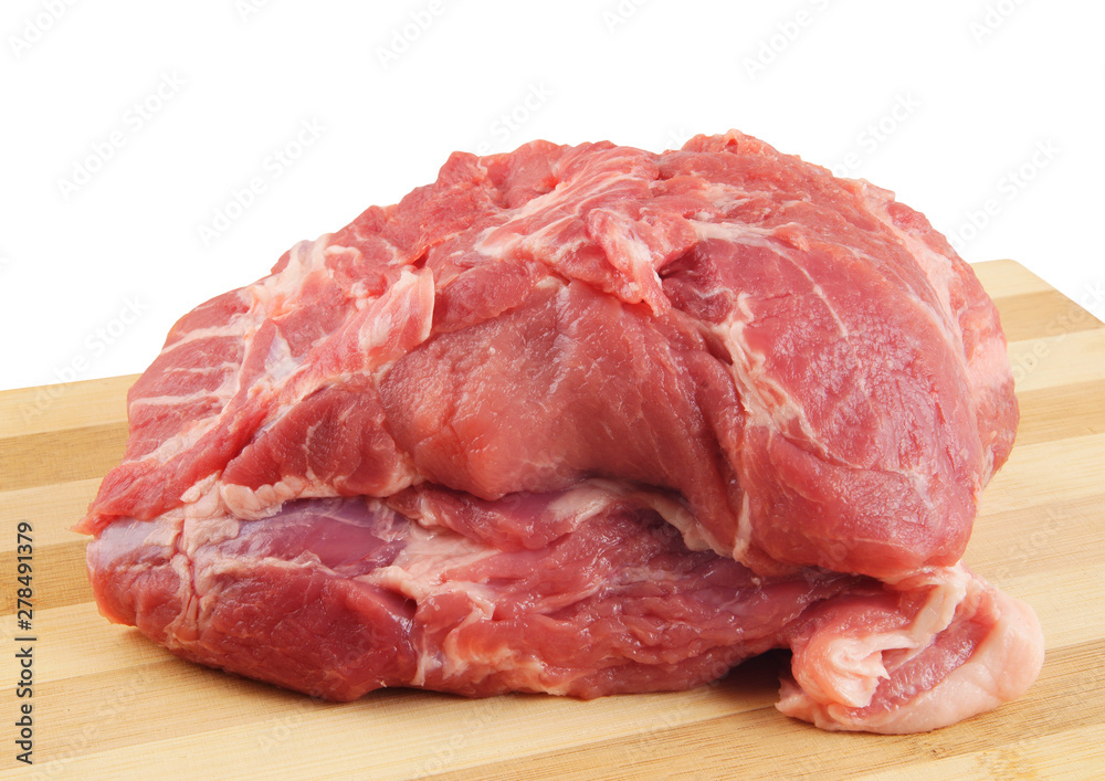 Pork on wooden board isolated on white