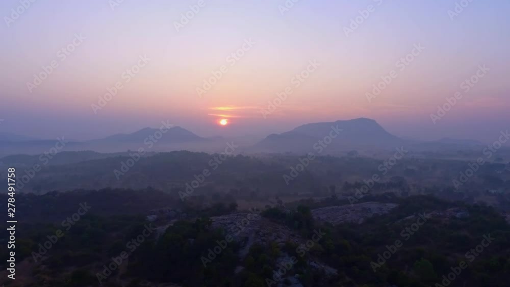 Panorama Of Sunrise In Hills With Slow Movement Across Barren Land. Panorama Of Sunrise In Hills With Slow Movement Across Barren Land.