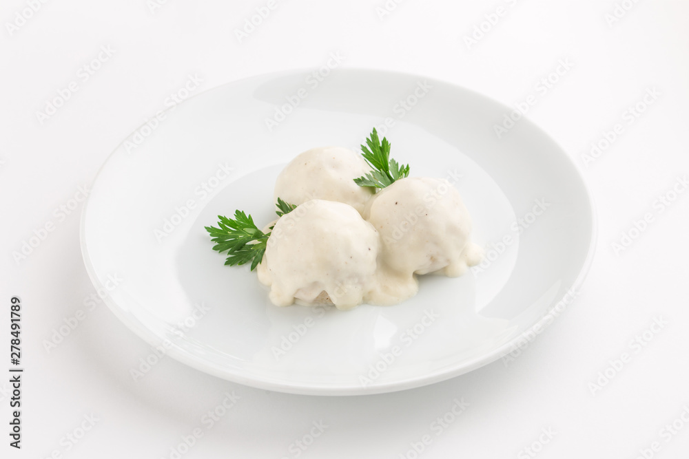Fish meatball with white sauce and parsley isolated on white background Fish meatball with white sauce and parsley isolated on white background