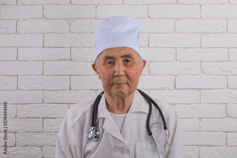 portrait of an elderly male medical doctor