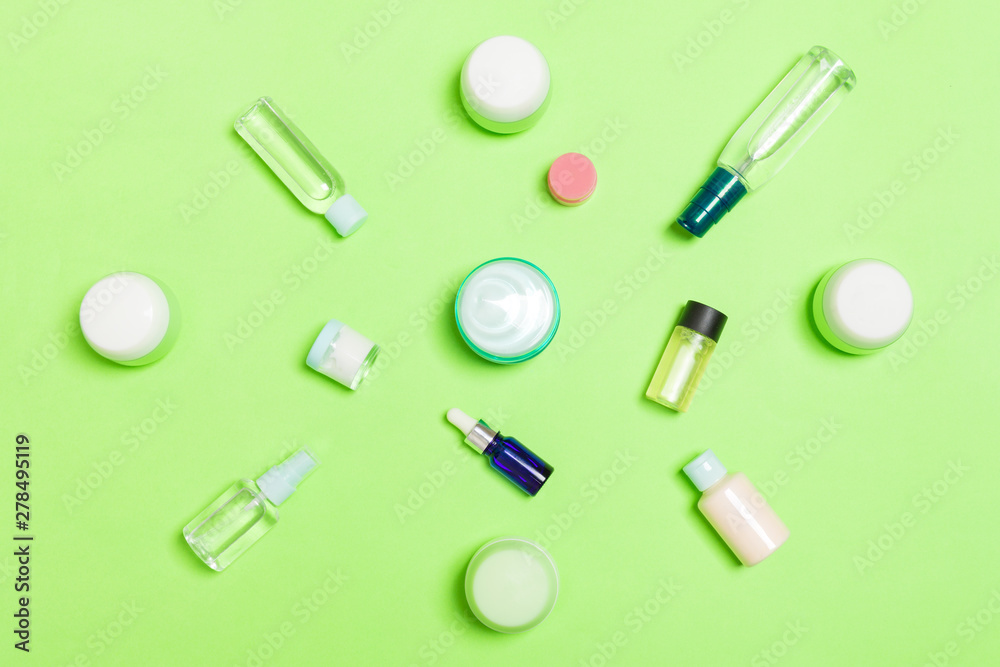 Group of plastic bodycare bottle Flat lay composition with cosmetic products on green background empty space for you design. Set of White Cosmetic containers, top view with copy space Group of plastic bodycare bottle Flat lay composition with cosmetic products on green background empty space for you design. Set of White Cosmetic containers, top view with copy space