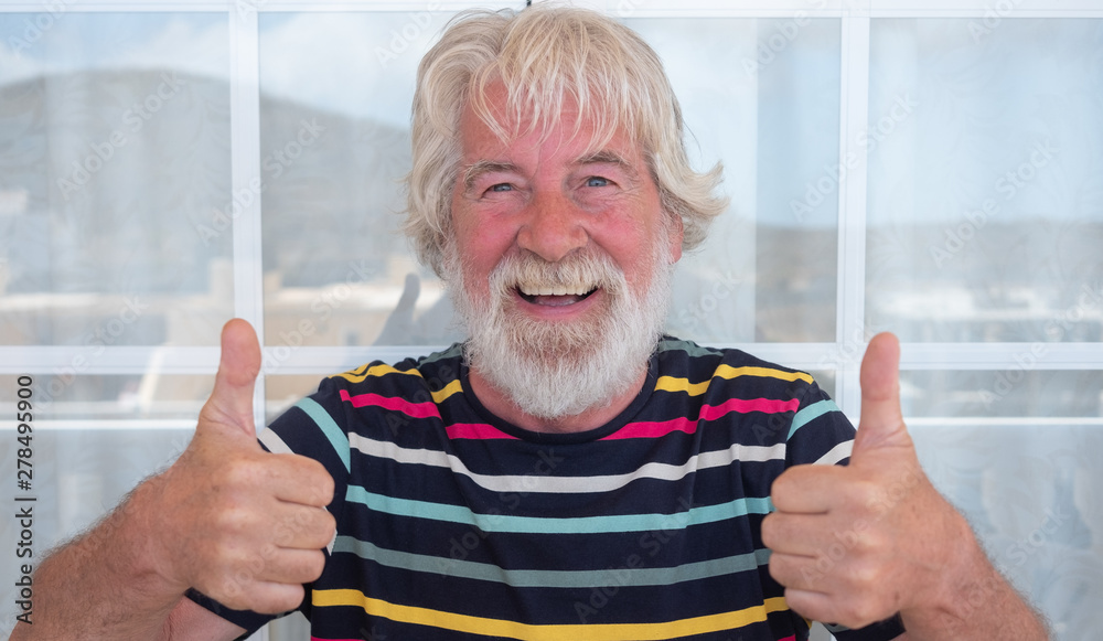 One people blue eyes smiles outdoor on the terrace. Attractive senior man white  beard and hair gesturing with hands. Funny expression. Striped t-shirt  colorful Stock Photo | Adobe Stock