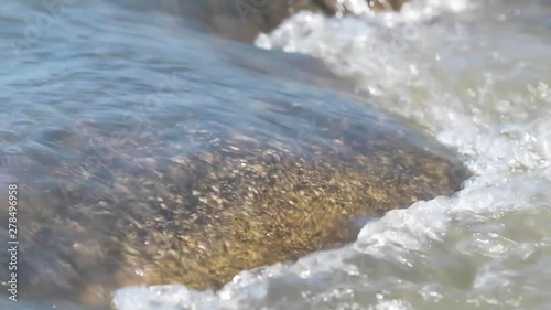 Water flowing over a rock. photo