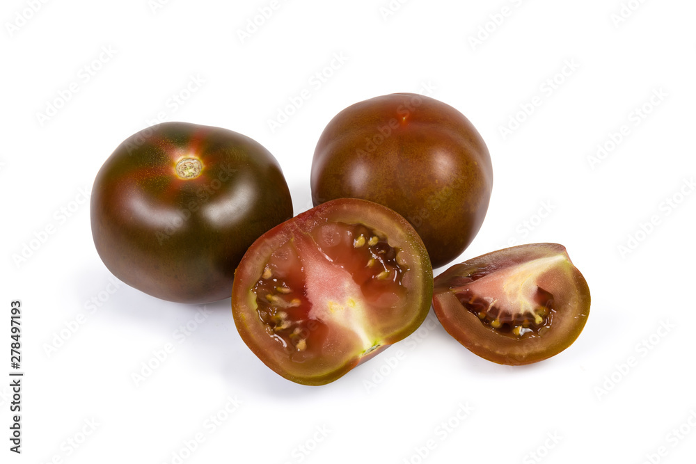 Obraz premium Whole and sliced tomatoes kumato on a white background