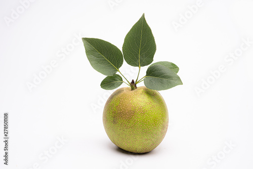 A fresh pear with leaves