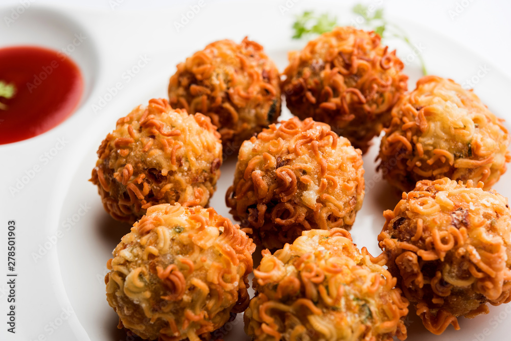 Crispy Noodles/maggie Pakora or pakoda is a popular indochinese street food served with ketchup Crispy Noodles/maggie Pakora or pakoda is a popular indochinese street food served with ketchup