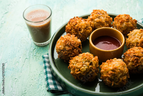 Crispy Noodles/maggie Pakora or pakoda is a popular indochinese street food served with ketchup photo