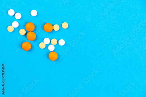 Tablets medicaments on a blue background