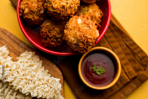 Crispy Noodles/maggie Pakora or pakoda is a popular indochinese street food served with ketchup photo