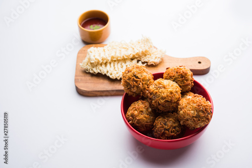 Crispy Noodles/maggie Pakora or pakoda is a popular indochinese street food served with ketchup photo