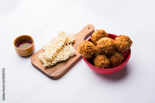 Crispy Noodles/maggie Pakora or pakoda is a popular indochinese street food served with ketchup photo