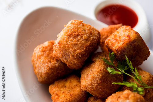Crispy Paneer popcorn is a popular party snack and an appetiser. selective focus