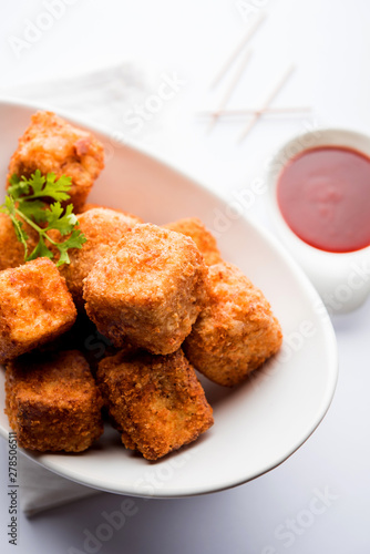 Crispy Paneer popcorn is a popular party snack and an appetiser. selective focus