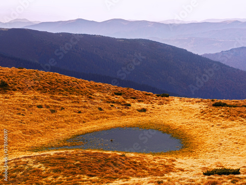 Carpatian village at mountains at the sunny day photo