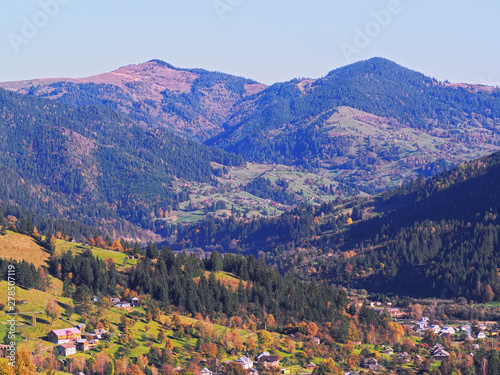 Carpatian village at mountains at the sunny day