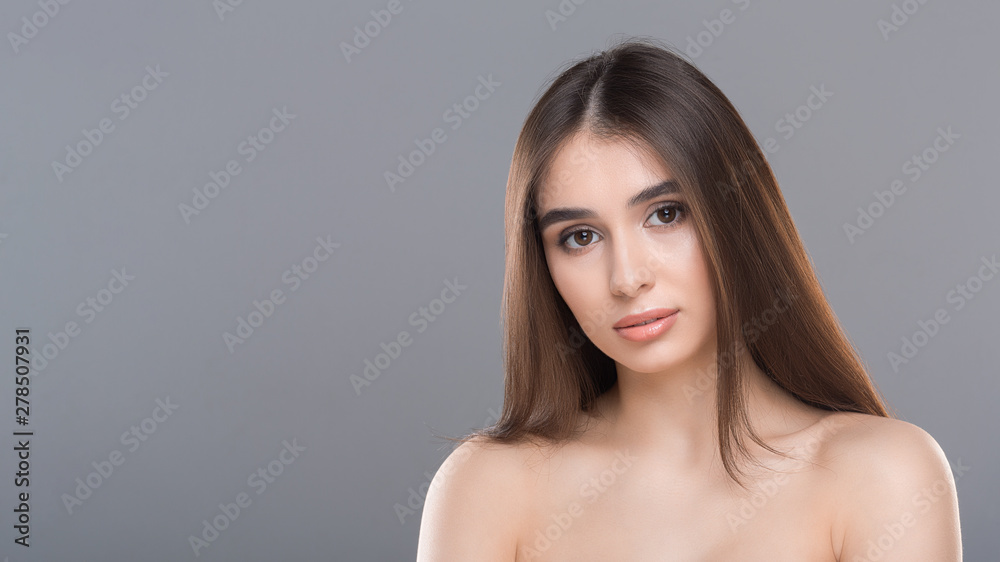 Young nude gorgeous woman portrait, grey panorama background Young nude gorgeous woman portrait, grey panorama background