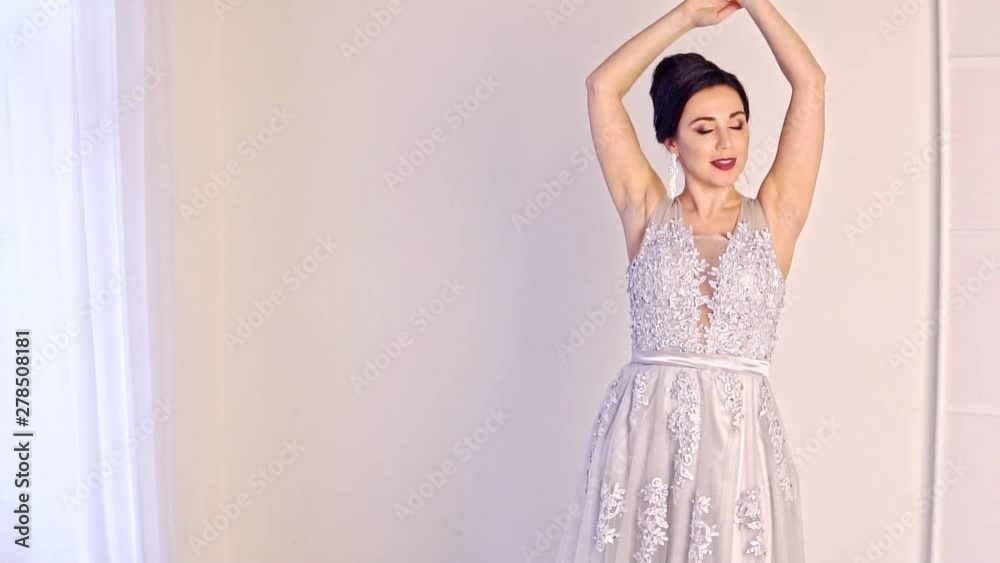 Fashion portrait of beautiful woman in elegant white dress. Fashion portrait of beautiful woman in elegant white dress.