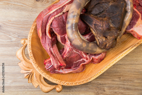 .Kazakh national wooden tableware Astau with meat for cooking national dish Beshparmak photo