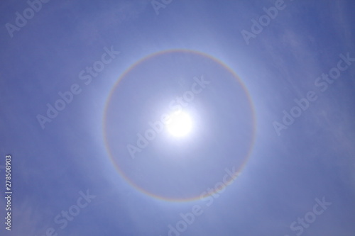 Fototapeta Naklejka Na Ścianę i Meble -  Stunning ring of sun halo with deep blue sky on sunny day