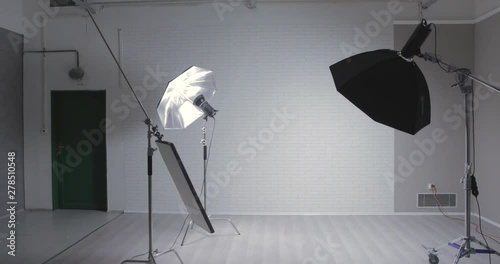 Empty photo stuid with c-stand, bouncing desk and octabox / jib moving shot photo