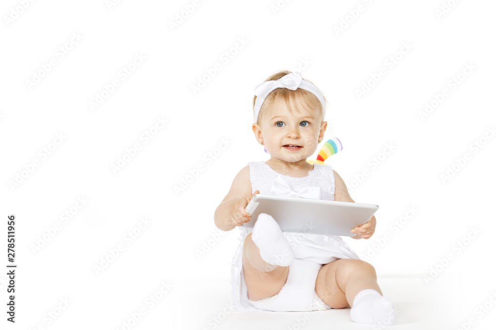little girl all in white with tablet and toy little girl all in white with tablet and toy