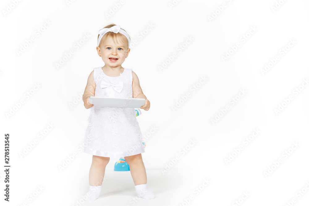 little girl all in white with a tablet little girl all in white with a tablet