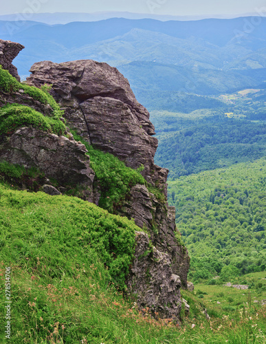 Rocks on Pikuy mount against the valley photo