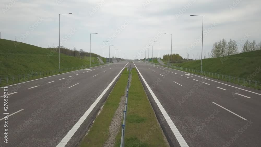 Panorama of the motorway with a bird's eye view. Transport artery of the country. The movement of vehicles on the highway. Landscape design of communication paths. Roadworks and marking. Stream cars. Panorama of the motorway with a bird's eye view. Transport artery of the country. The movement of vehicles on the highway. Landscape design of communication paths. Roadworks and marking. Stream cars.