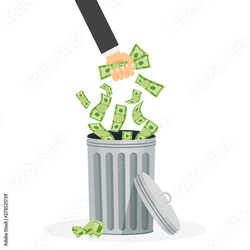 Waste of money. Hand throws paper money into the trash