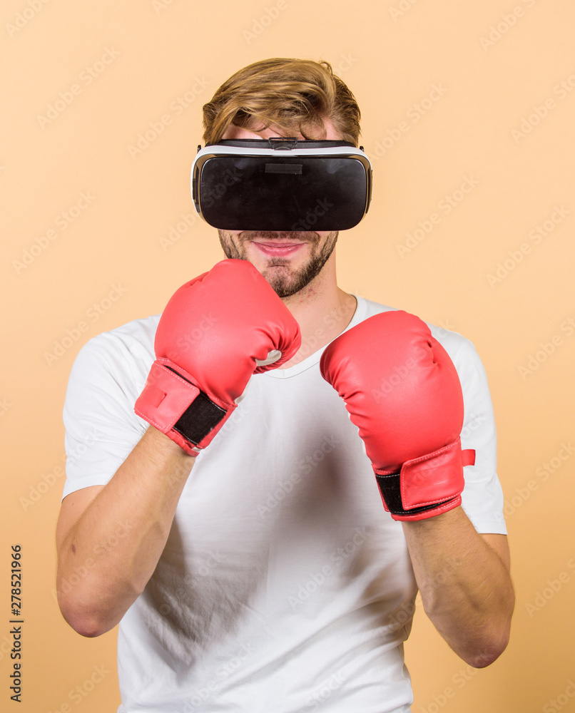 Cyber coach online training. Cyber sportsman boxing gloves. Augmented 3D world. Man boxer virtual reality headset simulation. Man play game in VR glasses